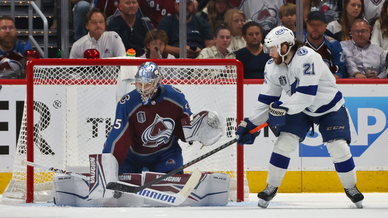 DENVER, COLORADO - JUNE 18: Goaltender Darcy Kuemper #35 of the Colorado Avalanche makes a pad save as Brayden Point #21 of the Tampa Bay Lightning tries for the deflection in the third period of Game Two of the 2022 Stanley Cup Final at Ball Arena on June 18, 2022 in Denver, Colorado.