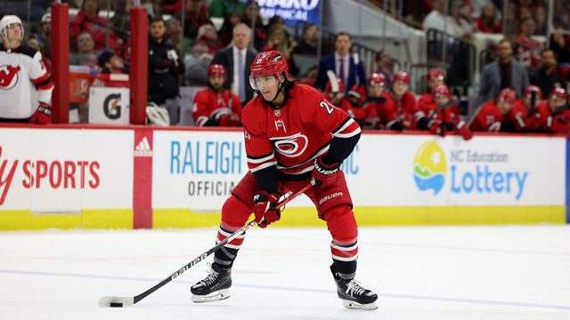 RALEIGH, NC - APRIL 28: Ethan Bear #25 of the Carolina Hurricanes skates with the puck during an NHL game against the New Jersey Devils on April 28, 2022 at PNC Arena in Raleigh, North Carolina.