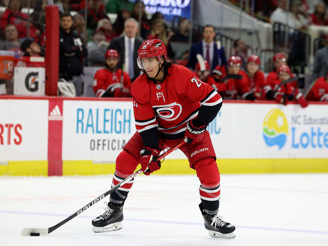 RALEIGH, NC - APRIL 28: Ethan Bear #25 of the Carolina Hurricanes skates with the puck during an NHL game against the New Jersey Devils on April 28, 2022 at PNC Arena in Raleigh, North Carolina.
