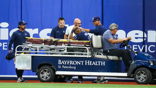 ST PETERSBURG, FL - JUNE 20: Manager Kevin Cash #16 of the Tampa Bay Rays pats Manuel Margot #13 as he is carted off the field due to injury in the ninth inning during the game against the New York Yankees at Tropicana Field on June 20, 2022 in St Petersburg, Florida.