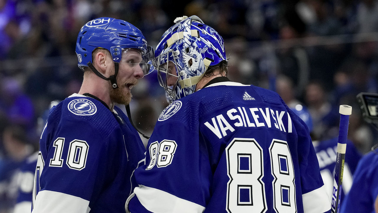 TAMPA, FL - JUNE 20: Tampa Bay Lightning right wing Corey Perry (10) and Tampa Bay Lightning goaltender Andrei Vasilevskiy (88) celebrate the win during the NHL Hockey Stanley Cup Finals Game 3 between Tampa Bay Lightning and the Colorado Avalanche on June 20th, 2022 at Amalie Arena in Tampa Florida