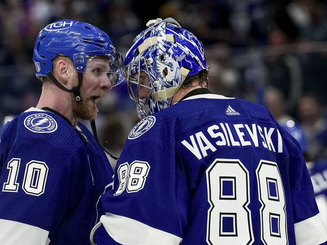 TAMPA, FL - JUNE 20: Tampa Bay Lightning right wing Corey Perry (10) and Tampa Bay Lightning goaltender Andrei Vasilevskiy (88) celebrate the win during the NHL Hockey Stanley Cup Finals Game 3 between Tampa Bay Lightning and the Colorado Avalanche on June 20th, 2022 at Amalie Arena in Tampa Florida
