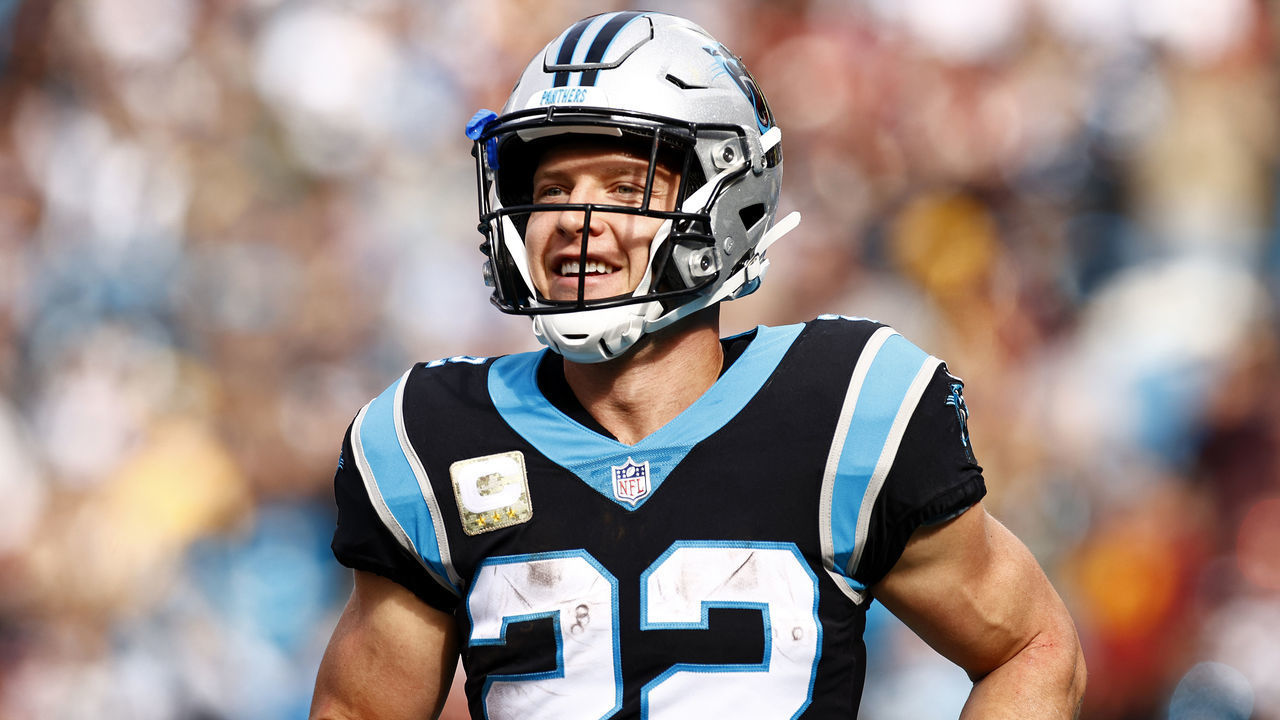 CHARLOTTE, NORTH CAROLINA - NOVEMBER 21: Christian McCaffrey #22 of the Carolina Panthers celebrate the first touchdown during the first quarter of the game against the Washington Football Team at Bank of America Stadium on November 21, 2021 in Charlotte, North Carolina.