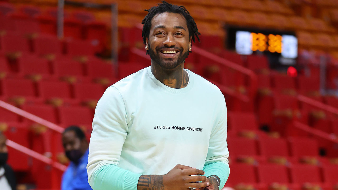 MIAMI, FLORIDA - MARCH 07: John Wall #1 of the Houston Rockets laughs prior to the game against the Miami Heat at FTX Arena on March 07, 2022 in Miami, Florida.
