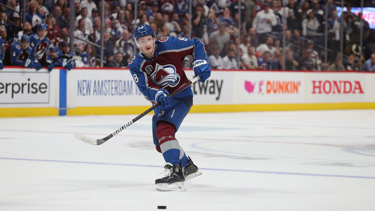 DENVER, COLORADO - JUNE 15: Cale Makar #8 of the Colorado Avalanche passes against the Tampa Bay Lightning in Game One of the 2022 Stanley Cup Final at Ball Arena on June 15, 2022 in Denver, Colorado.