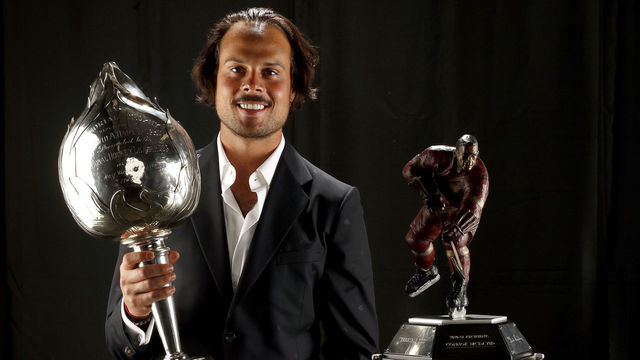 TAMPA, FLORIDA - JUNE 21: Auston Matthews of the Toronto Maple Leafs poses with the Hart Memorial Trophy for the most valuable player and the Ted Lindsay Award for the most outstanding player after the 2022 NHL Awards show at Armature Works on June 21, 2022 in Tampa, Florida.
