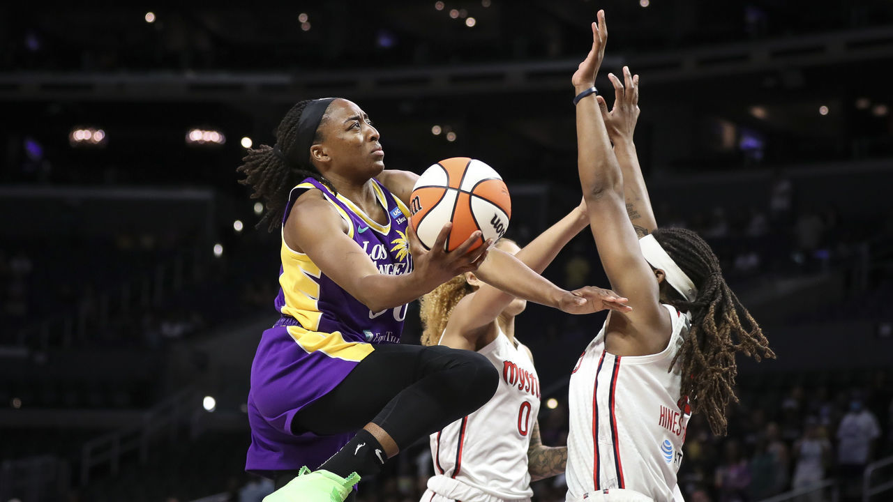 LOS ANGELES, CALIFORNIA - JUNE 21: Nneka Ogwumike #30 of the Los Angeles Sparks drives to the basket in the first half against Myisha Hines-Allen #2 of the Washington Mystics at Crypto.com Arena on June 21, 2022 in Los Angeles, California.