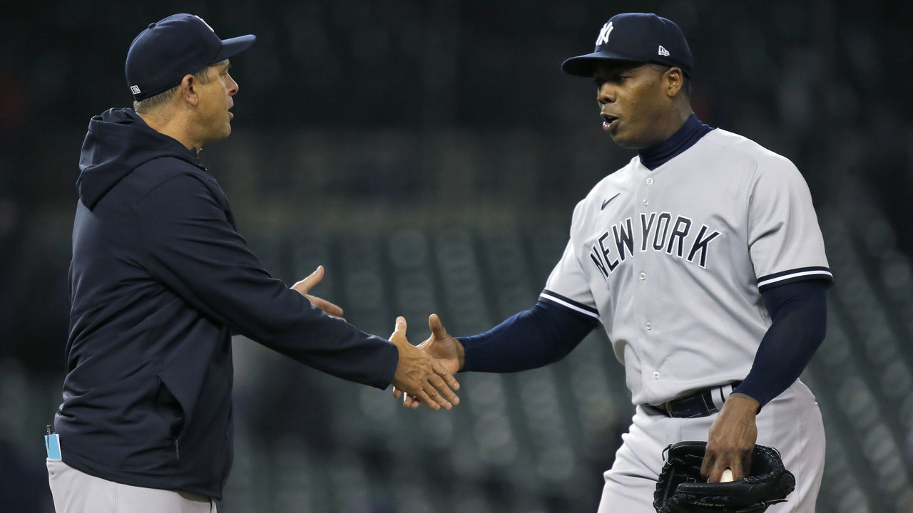 DETROIT, MI - APRIL 19: Manager Aaron Boone #17 of the New York Yankees congratulates closer Aroldis Chapman #54 after recording his second save in a 4-2 win over the Detroit Tigers at Comerica Park on April 19, 2022, in Detroit, Michigan.