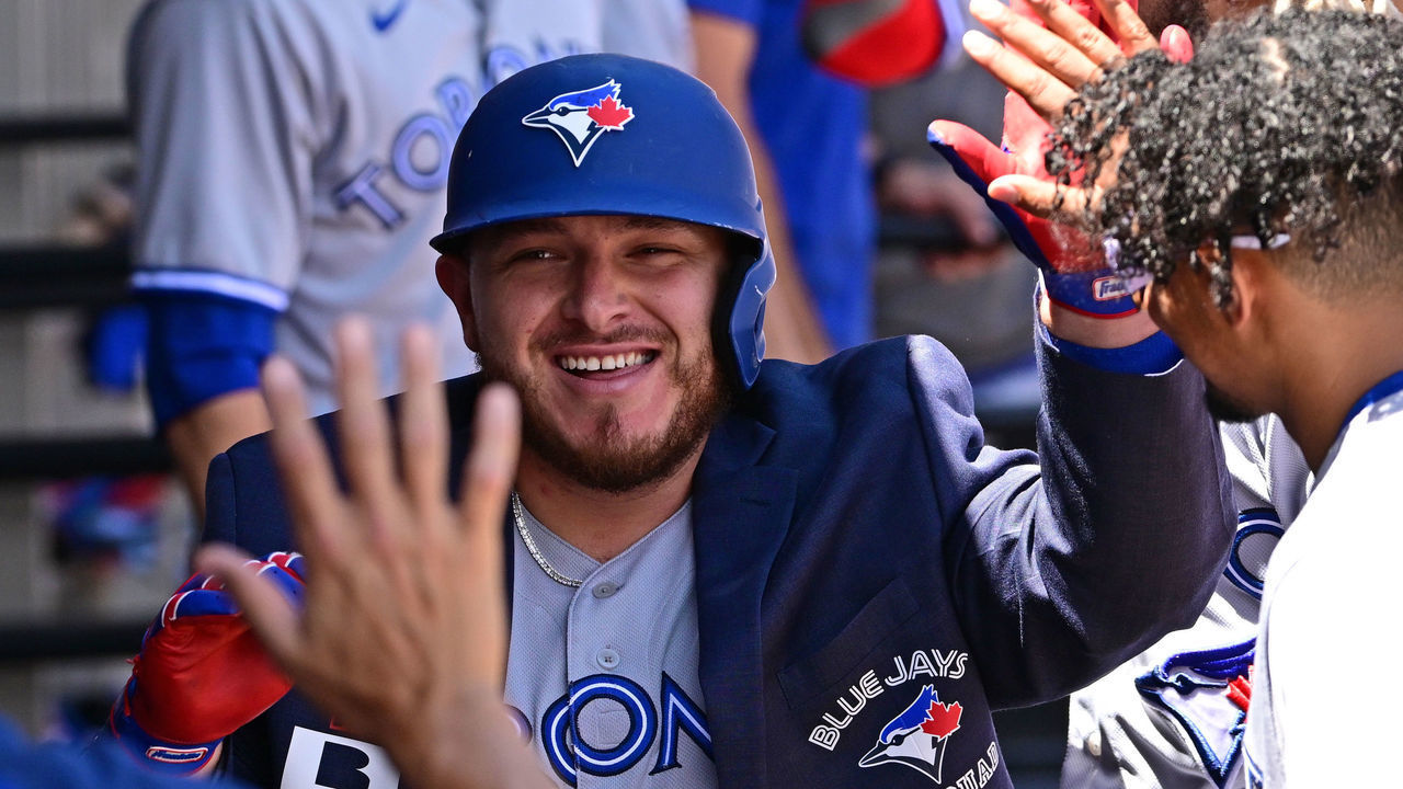 CHICAGO, ILLINOIS - JUNE 22: Alejandro Kirk #30 of the Toronto Blue Jays celebrates in the dugout with teammates after his home run in the third inning against the Chicago White Sox at Guaranteed Rate Field on June 22, 2022 in Chicago, Illinois.