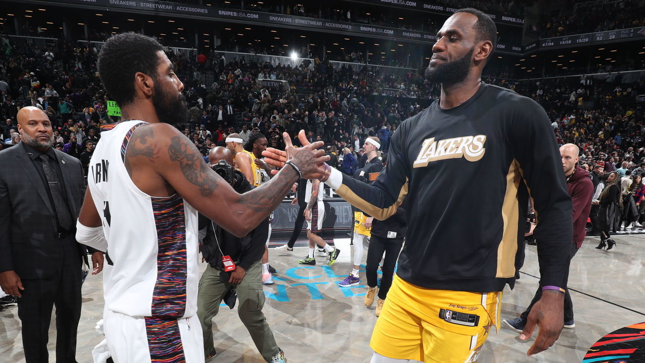 BROOKLYN, NY - JANUARY 23: Kyrie Irving #11 of the Brooklyn Nets and LeBron James #23 of the Los Angeles Lakers hi-five after a game on January 23, 2020 at Barclays Center in Brooklyn, New York. Mandatory Copyright Notice: Copyright 2020 NBAE