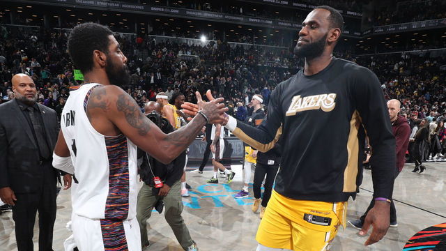 BROOKLYN, NY - JANUARY 23: Kyrie Irving #11 of the Brooklyn Nets and LeBron James #23 of the Los Angeles Lakers hi-five after a game on January 23, 2020 at Barclays Center in Brooklyn, New York. Mandatory Copyright Notice: Copyright 2020 NBAE