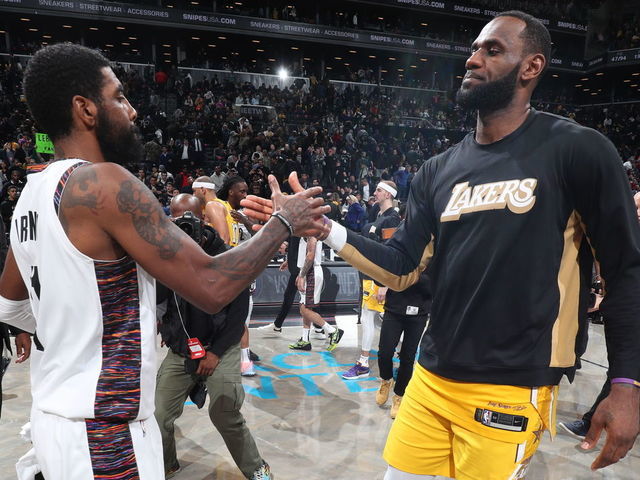 BROOKLYN, NY - JANUARY 23: Kyrie Irving #11 of the Brooklyn Nets and LeBron James #23 of the Los Angeles Lakers hi-five after a game on January 23, 2020 at Barclays Center in Brooklyn, New York. Mandatory Copyright Notice: Copyright 2020 NBAE