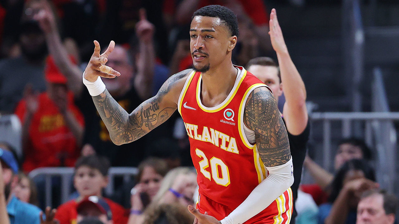 ATLANTA, GEORGIA - APRIL 22: John Collins #20 of the Atlanta Hawks celebrates a three pointer against the Miami Heat during the second quarter in Game Three of the Eastern Conference First Round at State Farm Arena on April 22, 2022 in Atlanta, Georgia.