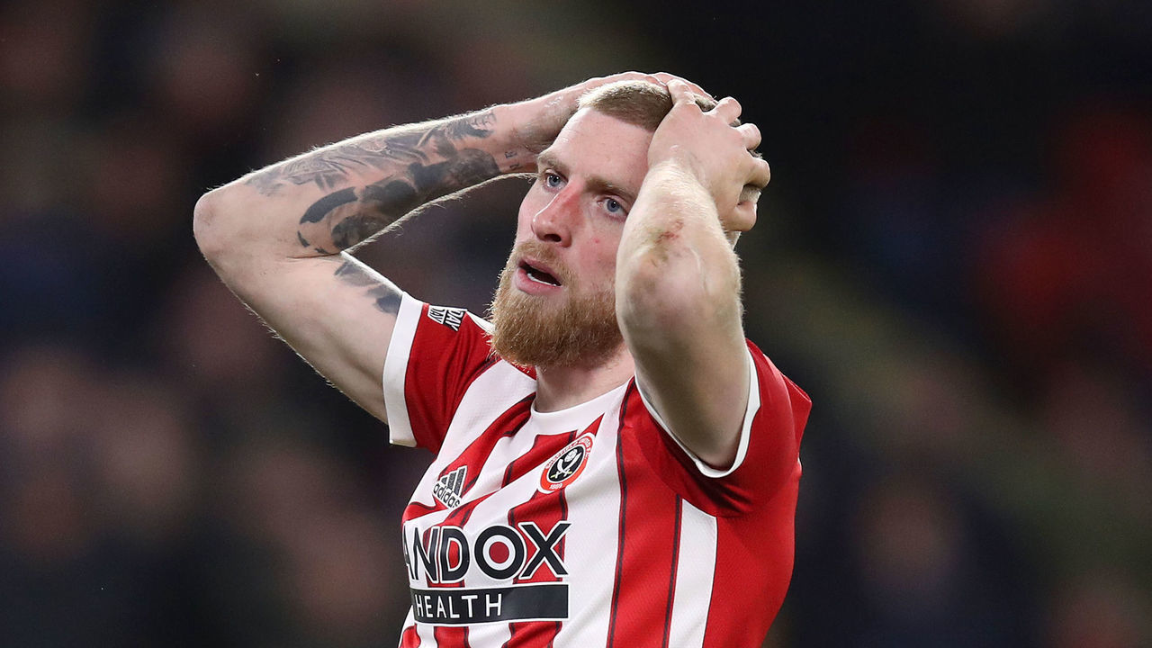 SHEFFIELD, ENGLAND - FEBRUARY 15: Oliver McBurnie of Sheffield United reacts after a missed chance during the Sky Bet Championship match between Sheffield United and Hull City at Bramall Lane on February 15, 2022 in Sheffield, England.