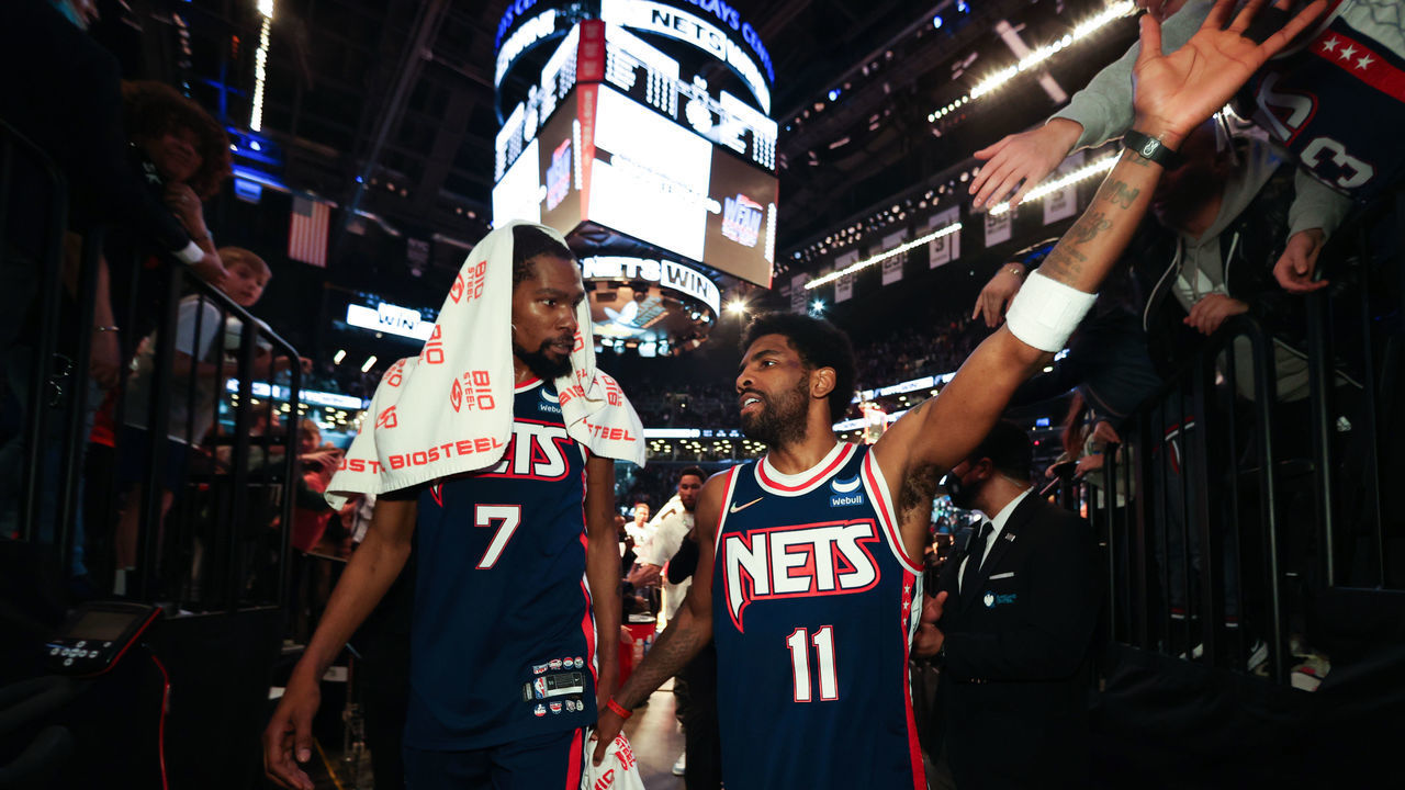 BROOKLYN, NY - APRIL 8: Kevin Durant #7 talks to Kyrie Irving #11 of the Brooklyn Nets after the game against the Cleveland Cavaliers on April 8, 2022 at Barclays Center in Brooklyn, New York. Mandatory Copyright Notice: Copyright 2022 NBAE