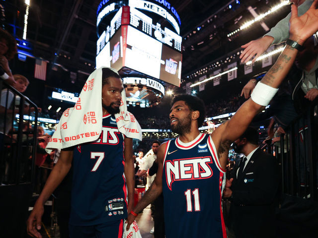 BROOKLYN, NY - APRIL 8: Kevin Durant #7 talks to Kyrie Irving #11 of the Brooklyn Nets after the game against the Cleveland Cavaliers on April 8, 2022 at Barclays Center in Brooklyn, New York. Mandatory Copyright Notice: Copyright 2022 NBAE