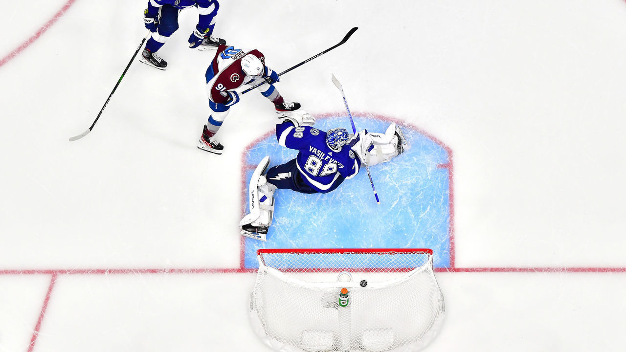 TAMPA, FLORIDA - JUNE 22: Nazem Kadri #91 of the Colorado Avalanche scores a goal against Andrei Vasilevskiy #88 of the Tampa Bay Lightning to win 3-2 in overtime in Game Four of the 2022 NHL Stanley Cup Final at Amalie Arena on June 22, 2022 in Tampa, Florida.