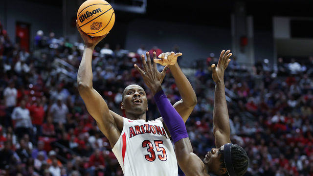 SAN DIEGO, CALIFORNIA - MARCH 20: Christian Koloko #35 of the Arizona Wildcats shoots the ball against Emanuel Miller #2 of the TCU Horned Frogs during the second half in the second round game of the 2022 NCAA Men's Basketball Tournament at Viejas Arena at San Diego State University on March 20, 2022 in San Diego, California.
