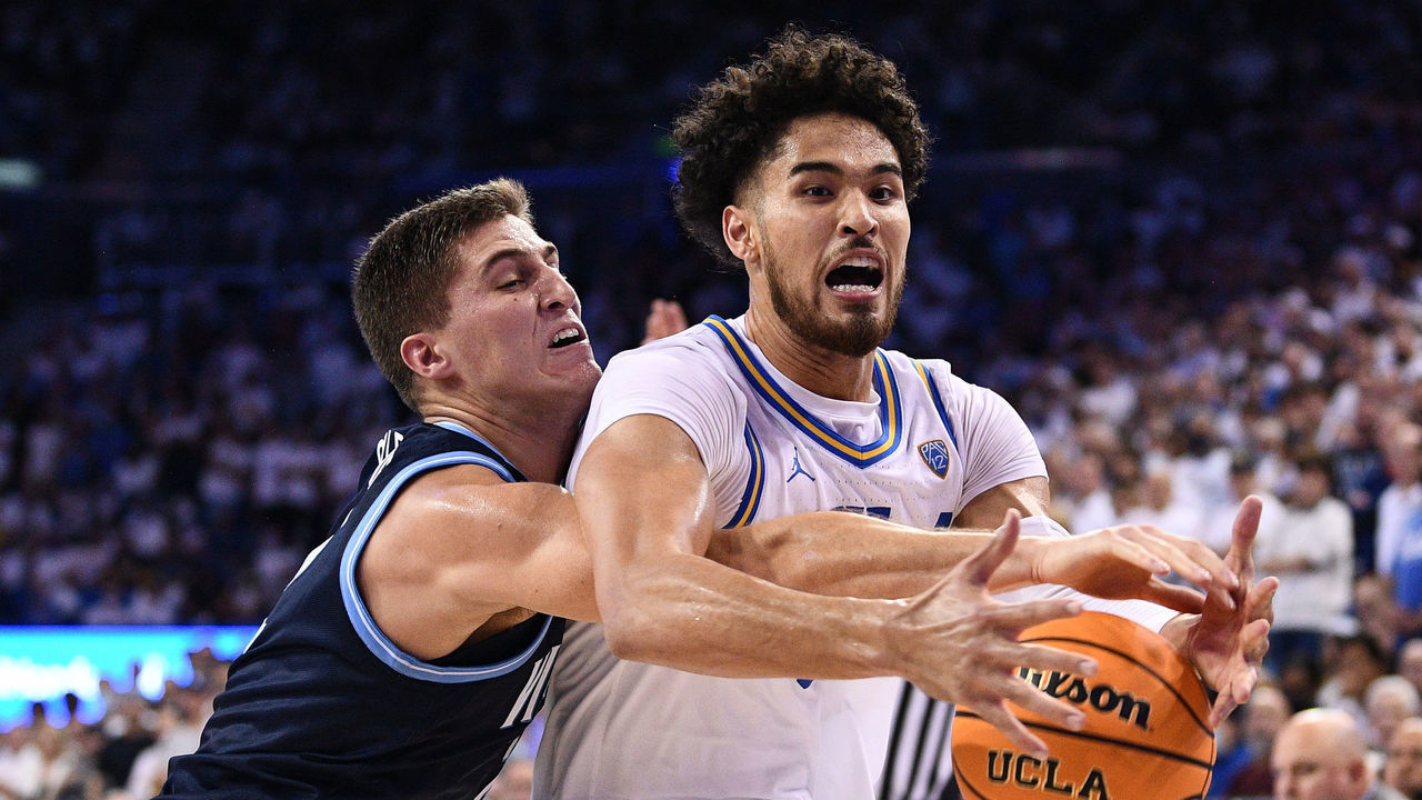 LOS ANGELES, CA - NOVEMBER 12: Villanova Wildcats guard Collin Gillespie (2) fouls UCLA Bruins guard Johnny Juzang (3) during a college basketball game between the Villanova Wildcats and the UCLA Bruins on November 12, 2021, at Pauley Pavilion in Los Angeles, CA.