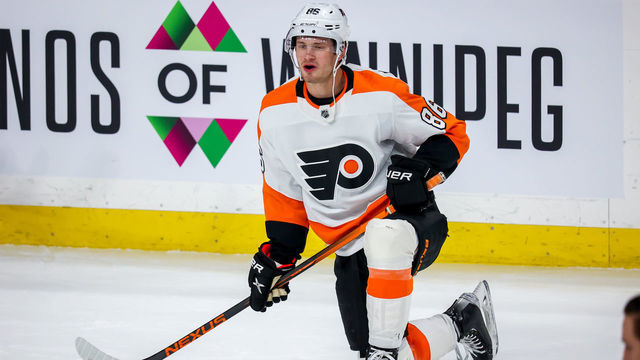 WINNIPEG, MB - APRIL 27: Joel Farabee #86 of the Philadelphia Flyers stretches during the pre-game warm up prior to NHL action against the Winnipeg Jets at Canada Life Centre on April 27, 2022 in Winnipeg, Manitoba, Canada.