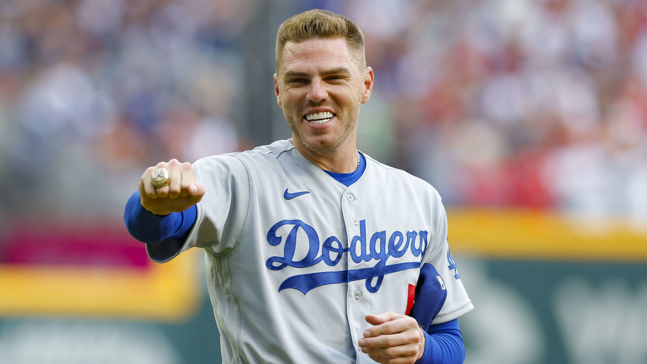 ATLANTA, GA - JUNE 24: Freddie Freeman #5 of the Los Angeles Dodgers receives his World Series Ring from his 2021 season with the Atlanta Braves prior to the game between the Los Angeles Dodgers and Atlanta Braves at Truist Park on June 24, 2022 in Atlanta, Georgia.