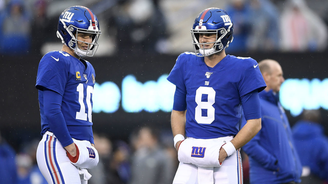 EAST RUTHERFORD, NEW JERSEY - DECEMBER 29: Eli Manning #10 and Daniel Jones #8 of the New York Giants talk prior to the game at MetLife Stadium on December 29, 2019 in East Rutherford, New Jersey.