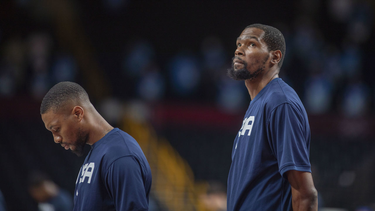 TOKYO, JAPAN August 7: Damian Lillard #6 of the United States and Kevin Durant #7 of the United States during the national anthem before the France V USA basketball final for men at the Saitama Super Arena during the Tokyo 2020 Summer Olympic Games on August 7, 2021 in Tokyo, Japan.