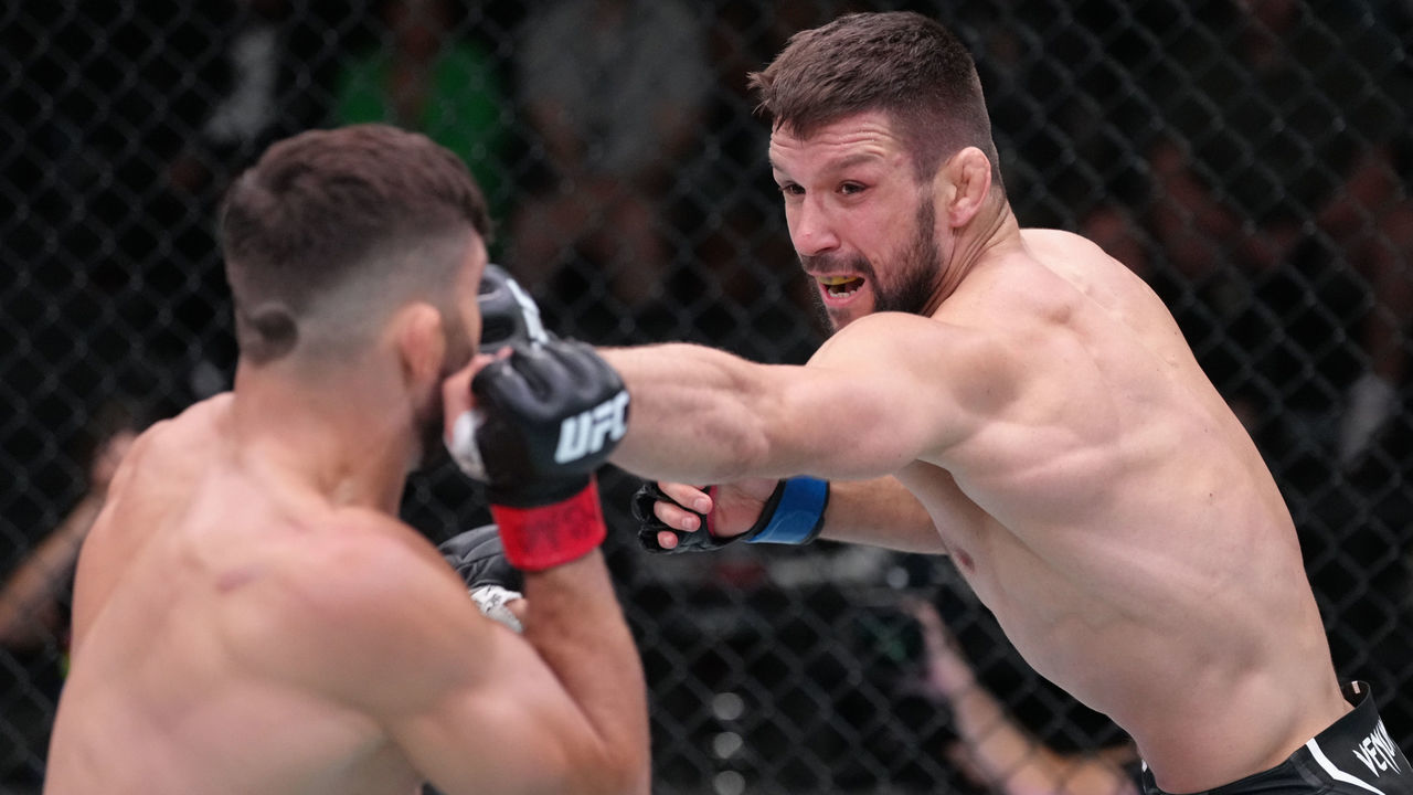 LAS VEGAS, NEVADA - JUNE 25: (R-L) Mateusz Gamrot of Poland punches Arman Tsarukyan of Georgia in a lightweight fight during the UFC Fight Night event at UFC APEX on June 25, 2022 in Las Vegas, Nevada.