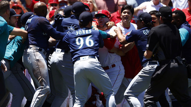 ANAHEIM, CALIFORNIA - JUNE 26: The Seattle Mariners and the Los Angeles Angels clear the benches after Jesse Winker #27 of the Seattle Mariners charged the Angels dugout after being hit by a pitch in the second inning at Angel Stadium of Anaheim on June 26, 2022 in Anaheim, California.