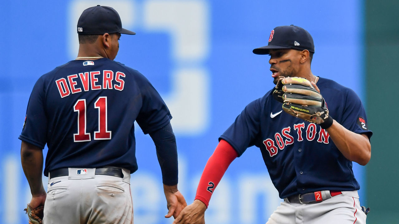 CLEVELAND, OH - JUNE 26: Rafael Devers #11 and Xander Bogaerts #2 of the Boston Red Sox celebrate the team's 8-3 win over the Cleveland Guardians at Progressive Field on June 26, 2022 in Cleveland, Ohio.