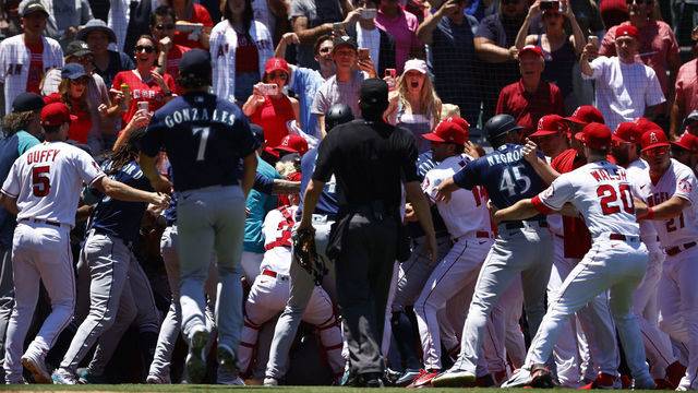 ANAHEIM, CALIFORNIA - JUNE 26: The Seattle Mariners and the Los Angeles Angels clear the benches after Jesse Winker #27 of the Seattle Mariners charged the Angels dugout after being hit by a pitch in the second inning at Angel Stadium of Anaheim on June 26, 2022 in Anaheim, California.