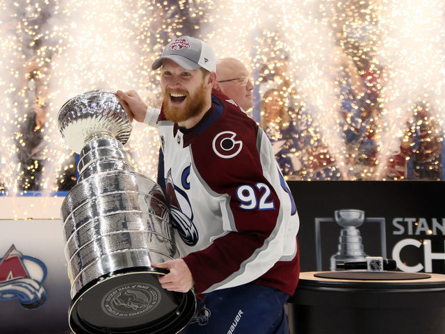 TAMPA, FLORIDA - JUNE 26: Gabriel Landeskog #92 of the Colorado Avalanche lifts the Stanley Cup after defeating the Tampa Bay Lightning 2-1 in Game Six of the 2022 NHL Stanley Cup Final at Amalie Arena on June 26, 2022 in Tampa, Florida.