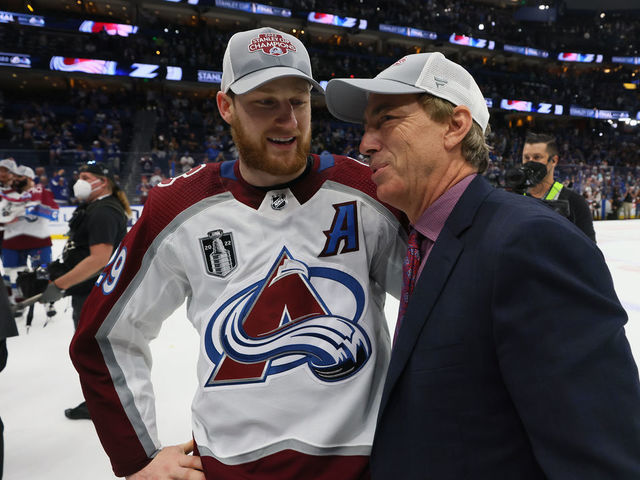 TAMPA, FLORIDA - JUNE 26: Nathan MacKinnon #29 of the Colorado Avalanche talks with General Manager Joe Sakic after defeating the Tampa Bay Lightning 2-1 in Game Six of the 2022 NHL Stanley Cup Final at Amalie Arena on June 26, 2022 in Tampa, Florida.