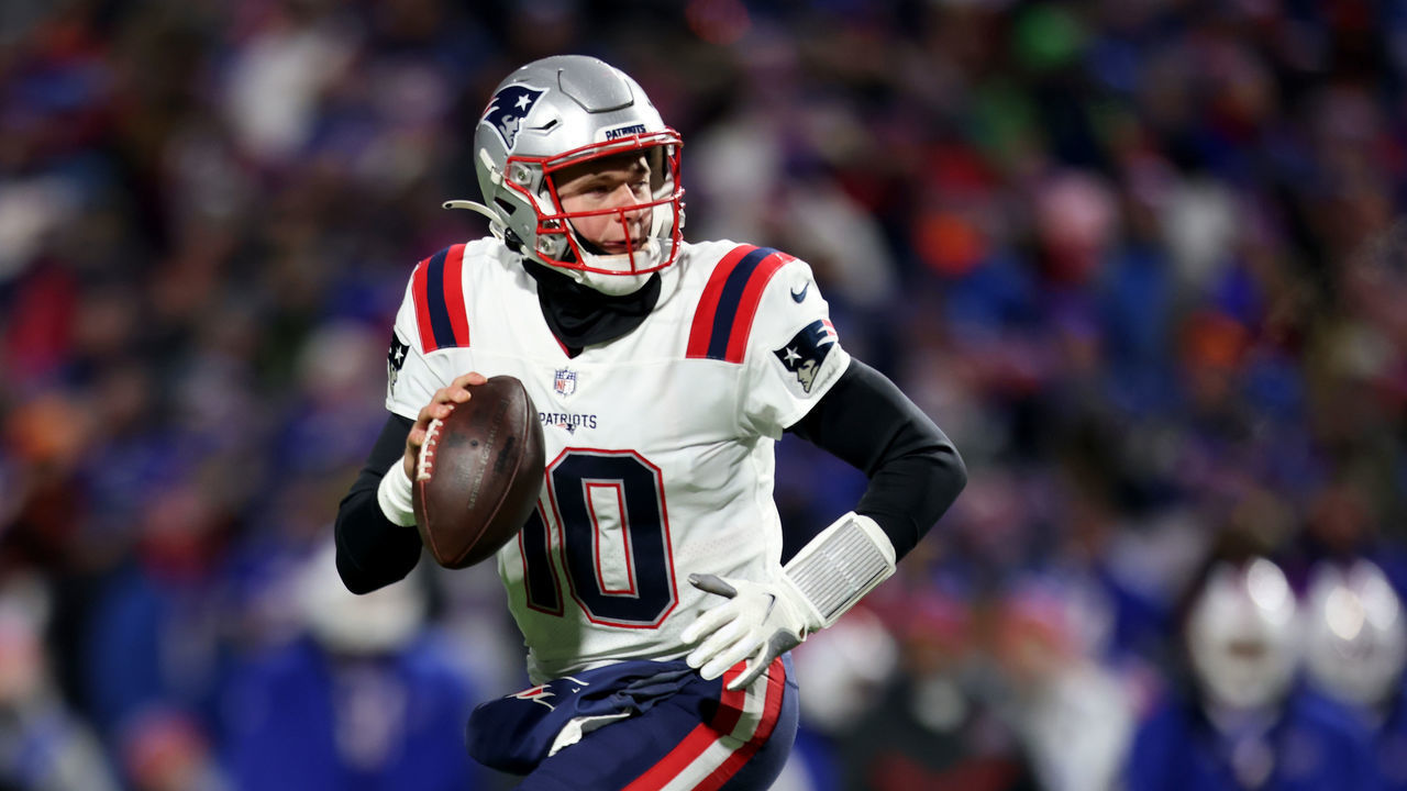 BUFFALO, NEW YORK - JANUARY 15: Mac Jones #10 of the New England Patriots looks to pass during the third quarter against the Buffalo Bills at Highmark Stadium on January 15, 2022 in Buffalo, New York.