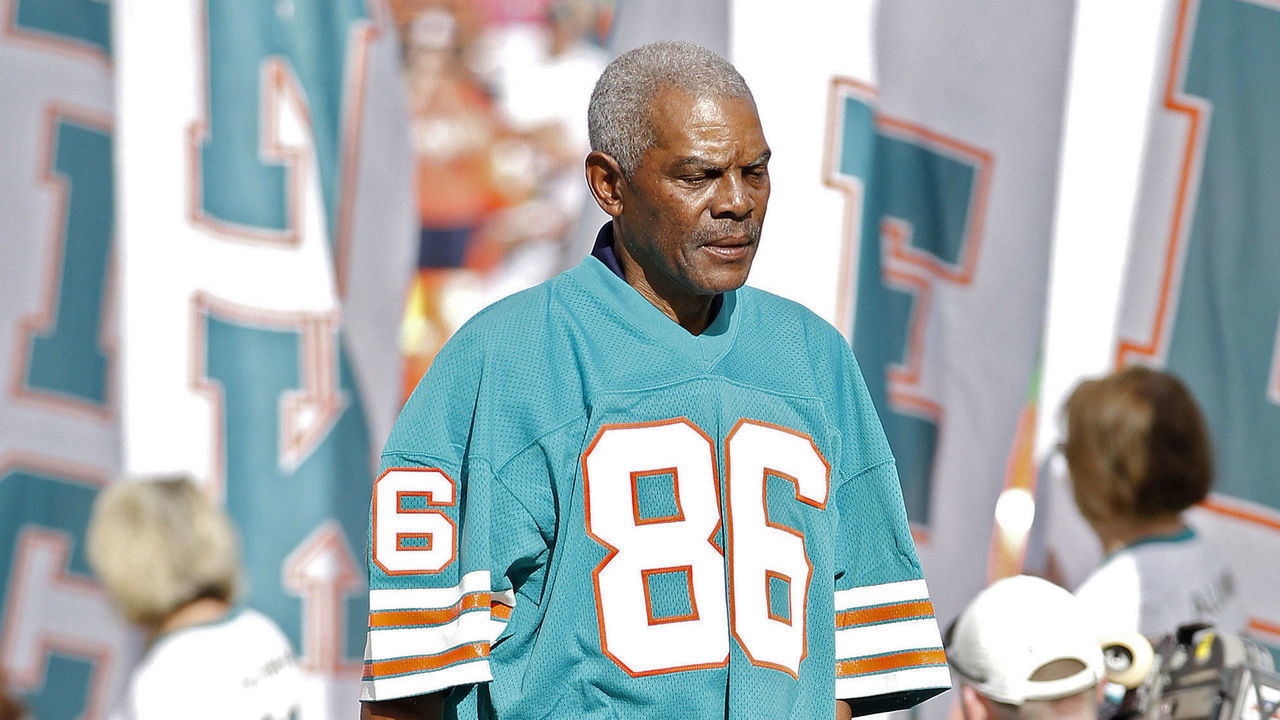 MIAMI GARDENS, FL - DECEMBER 16: Wide receiver Marlin Briscoe #86 of the 1972 Miami Dolphins is honored with the rest of the undefeated team at a ceremony during halftime of the game against the Jacksonville Jaguars on December 16, 2012 at Sun Life Stadium in Miami Gardens, Florida. The Dolphins defeated the Jaguars 24-3.
