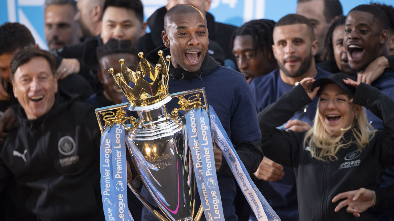 MANCHESTER, ENGLAND - MAY 23: Fernandinho of Manchester City with the Premier LEague trophy during the Manchester City FC Victory Parade on May 23, 2022 in Manchester, England.