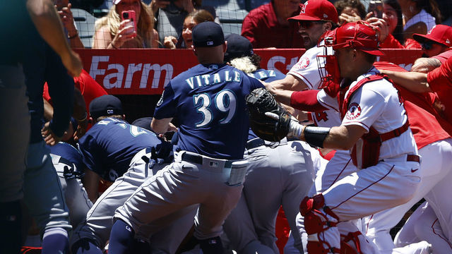 ANAHEIM, CALIFORNIA - JUNE 26: The Seattle Mariners and the Los Angeles Angels clear the benches after Jesse Winker #27 of the Seattle Mariners charged the Angels dugout after being hit by a pitch in the second inning at Angel Stadium of Anaheim on June 26, 2022 in Anaheim, California.