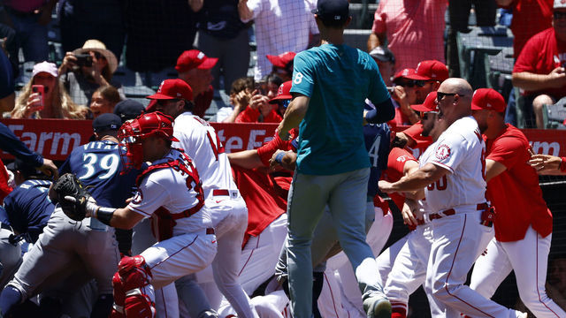 ANAHEIM, CALIFORNIA - JUNE 26: The Seattle Mariners and the Los Angeles Angels clear the benches after Jesse Winker #27 of the Seattle Mariners charged the Angels dugout after being hit by a pitch in the second inning at Angel Stadium of Anaheim on June 26, 2022 in Anaheim, California.