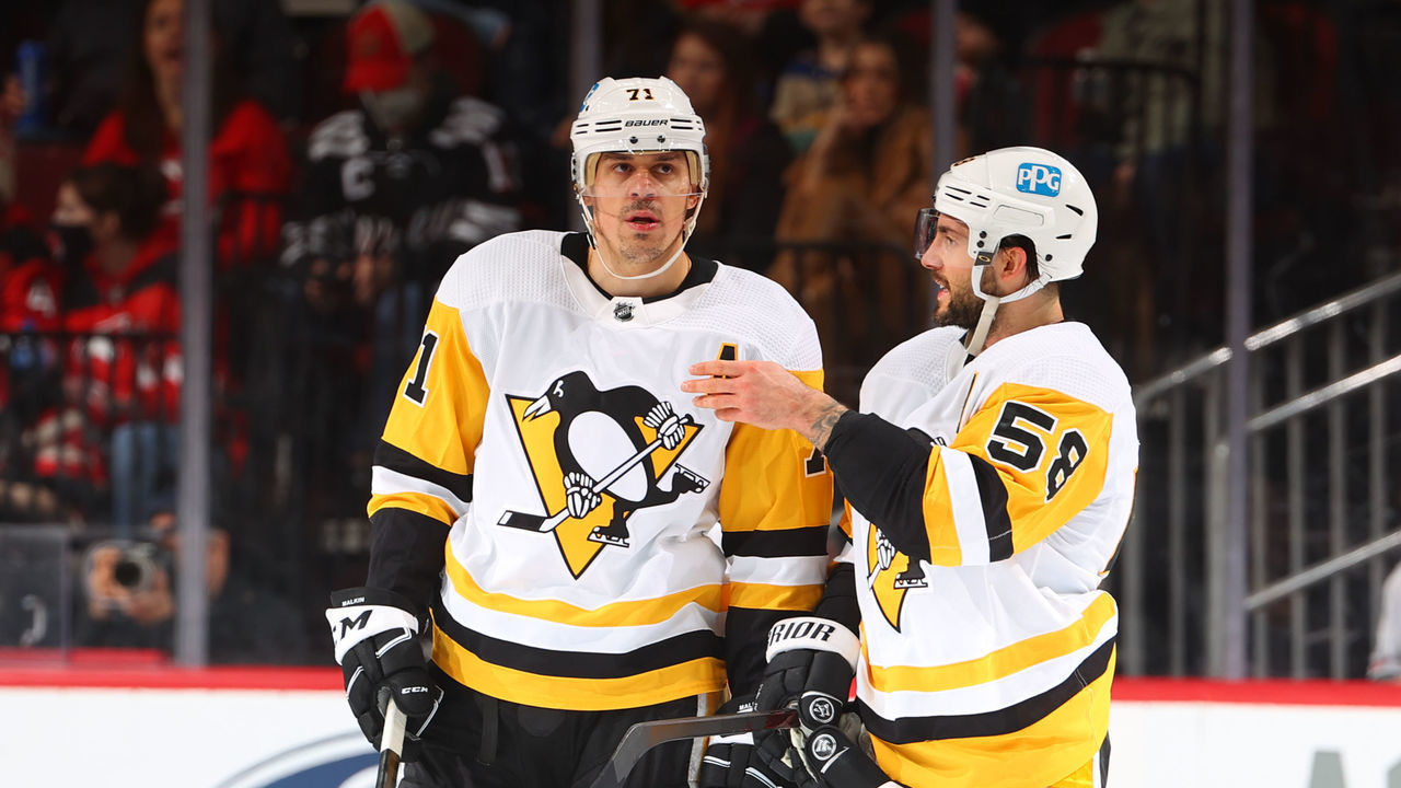 NEWARK, NJ - FEBRUARY 13: Evgeni Malkin #71 of the Pittsburgh Penguins and Kris Letang #58 of the Pittsburgh Penguins talk during the second period against the New Jersey Devils on February 13, 2022 at the Prudential Center in Newark, New Jersey.