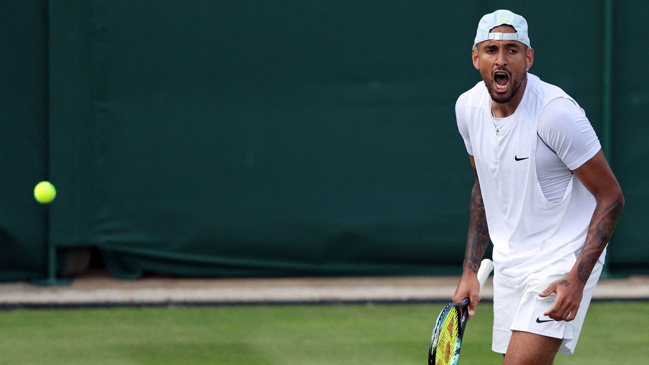 Australia's Nick Kyrgios reacts as he competes against Britain's Paul Jubb during their men's singles tennis match on the second day of the 2022 Wimbledon Championships at The All England Tennis Club in Wimbledon, southwest London, on June 28, 2022. - RESTRICTED TO EDITORIAL USE
