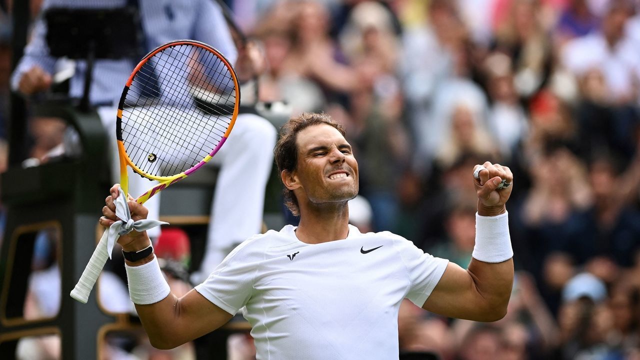 Spain's Rafael Nadal celebrates winning against Argentina's Francisco Cerundolo at the end of their men's singles tennis match on the second day of the 2022 Wimbledon Championships at The All England Tennis Club in Wimbledon, southwest London, on June 28, 2022. - RESTRICTED TO EDITORIAL USE