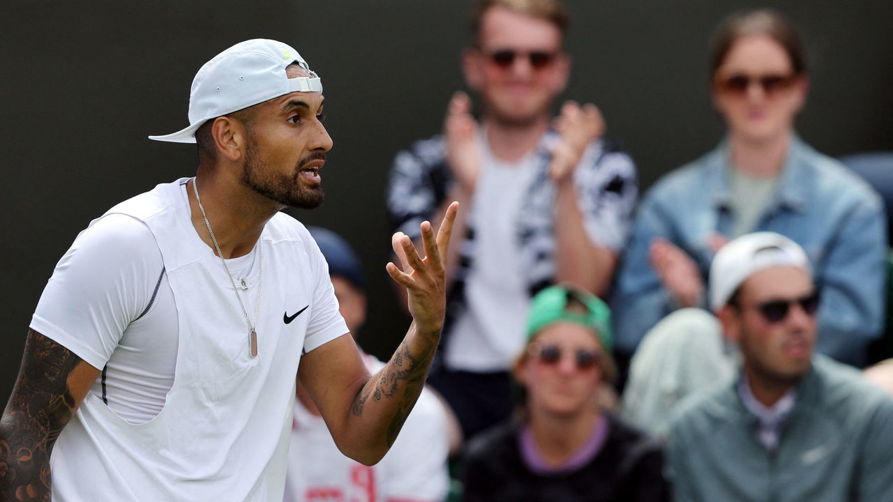 Australia's Nick Kyrgios reacts as he competes against Britain's Paul Jubb during their men's singles tennis match on the second day of the 2022 Wimbledon Championships at The All England Tennis Club in Wimbledon, southwest London, on June 28, 2022. - RESTRICTED TO EDITORIAL USE