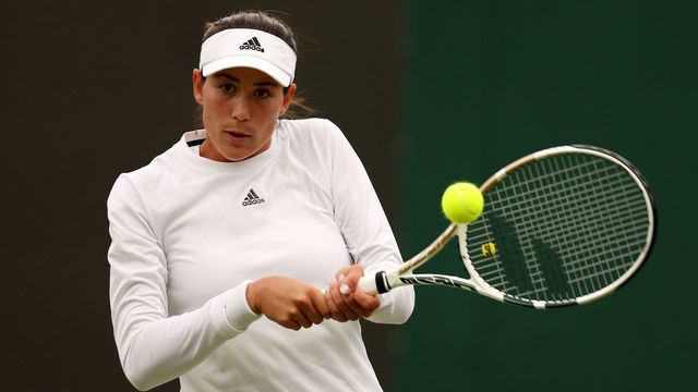 LONDON, ENGLAND - JUNE 28: Garbine Muguruza of Spain plays a backhand against Greet Minnen of Belgium during their Women's Singles First Round Match on day two of The Championships Wimbledon 2022 at All England Lawn Tennis and Croquet Club on June 28, 2022 in London, England.