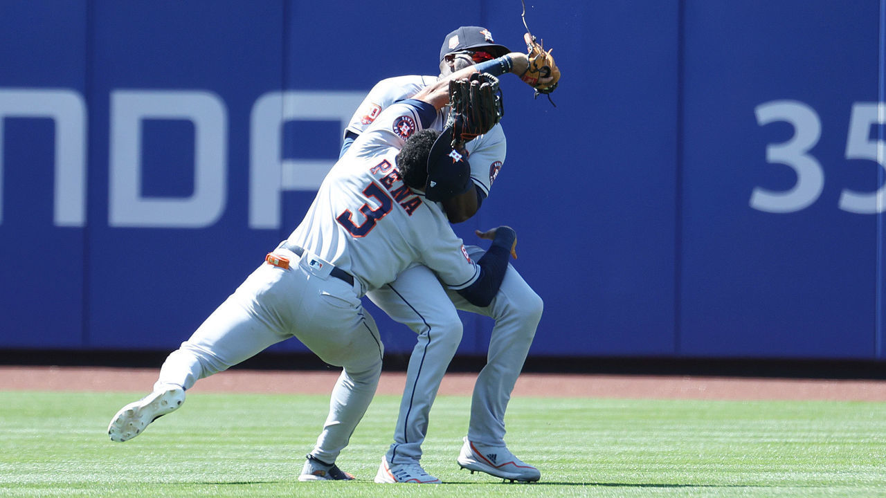 NEW YORK, NEW YORK - JUNE 29: Jeremy Pena #3 crashes into Yordan Alvarez #44 of the Houston Astros while making a catch hit by Dominic Smith #2 of the New York Mets in the eighth inning during their game at Citi Field on June 29, 2022 in New York City.