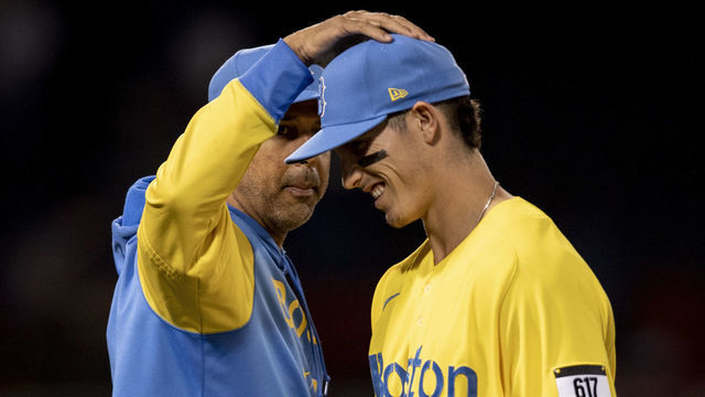 BOSTON, MA - JUNE 22: Manager Alex Cora #13 of the Boston Red Sox reacts with Jarren Duran #40 of the Boston Red Sox after a win against the Detroit Tigers on June 22, 2022 at Fenway Park in Boston, Massachusetts.