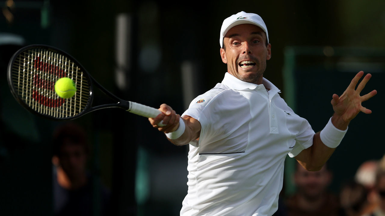 LONDON, ENGLAND - JUNE 28: Roberto Bautista Agut of Spain plays a forehand against Attila Balazs of Hungary during their Men's Singles First Round Match on day two of The Championships Wimbledon 2022 at All England Lawn Tennis and Croquet Club on June 28, 2022 in London, England.