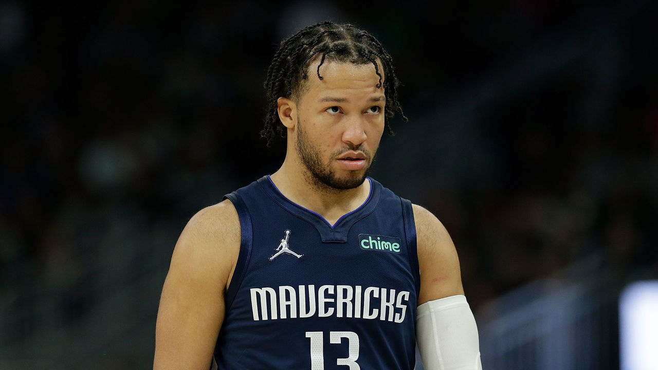 MILWAUKEE, WISCONSIN - APRIL 03: Jalen Brunson #13 of the Dallas Mavericks walks down court during the second half of the game against the Milwaukee Bucks at Fiserv Forum on April 03, 2022 in Milwaukee, Wisconsin.