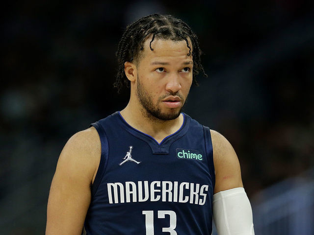 MILWAUKEE, WISCONSIN - APRIL 03: Jalen Brunson #13 of the Dallas Mavericks walks down court during the second half of the game against the Milwaukee Bucks at Fiserv Forum on April 03, 2022 in Milwaukee, Wisconsin.