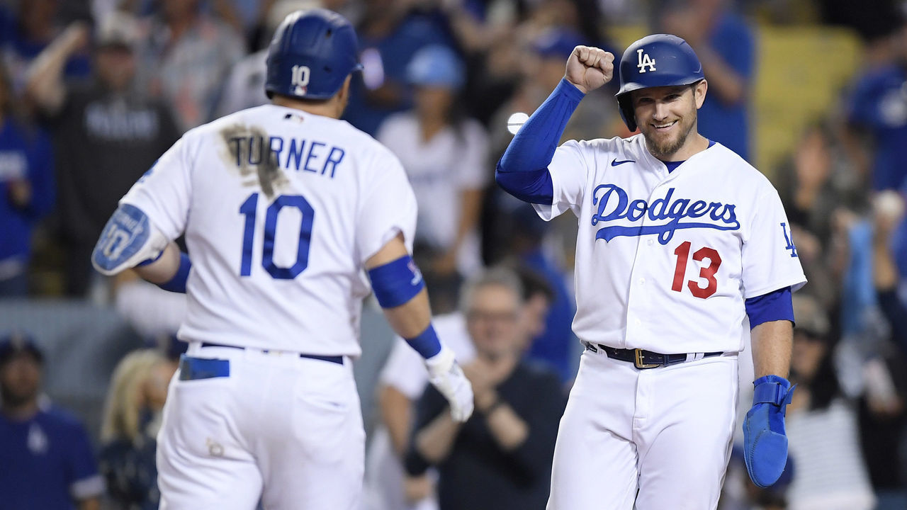 LOS ANGELES, CA - JUNE 30: Max Muncy #13 of the Los Angeles Dodgers celebrates after scoring off a two-run home run by Justin Turner #10 against starting pitcher Joe Musgrove #44 of the San Diego Padres during the seventh inning at Dodger Stadium on June 30, 2022 in Los Angeles, California.