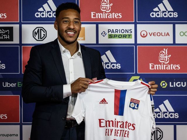 French midfielder Corentin Tolisso poses with his jersey during a press conference to announce his return to Ligue 1 Olympique Lyonnais (OL) football club in Decines-Charpieu near Lyon centraleastern of France on July 1, 2022.